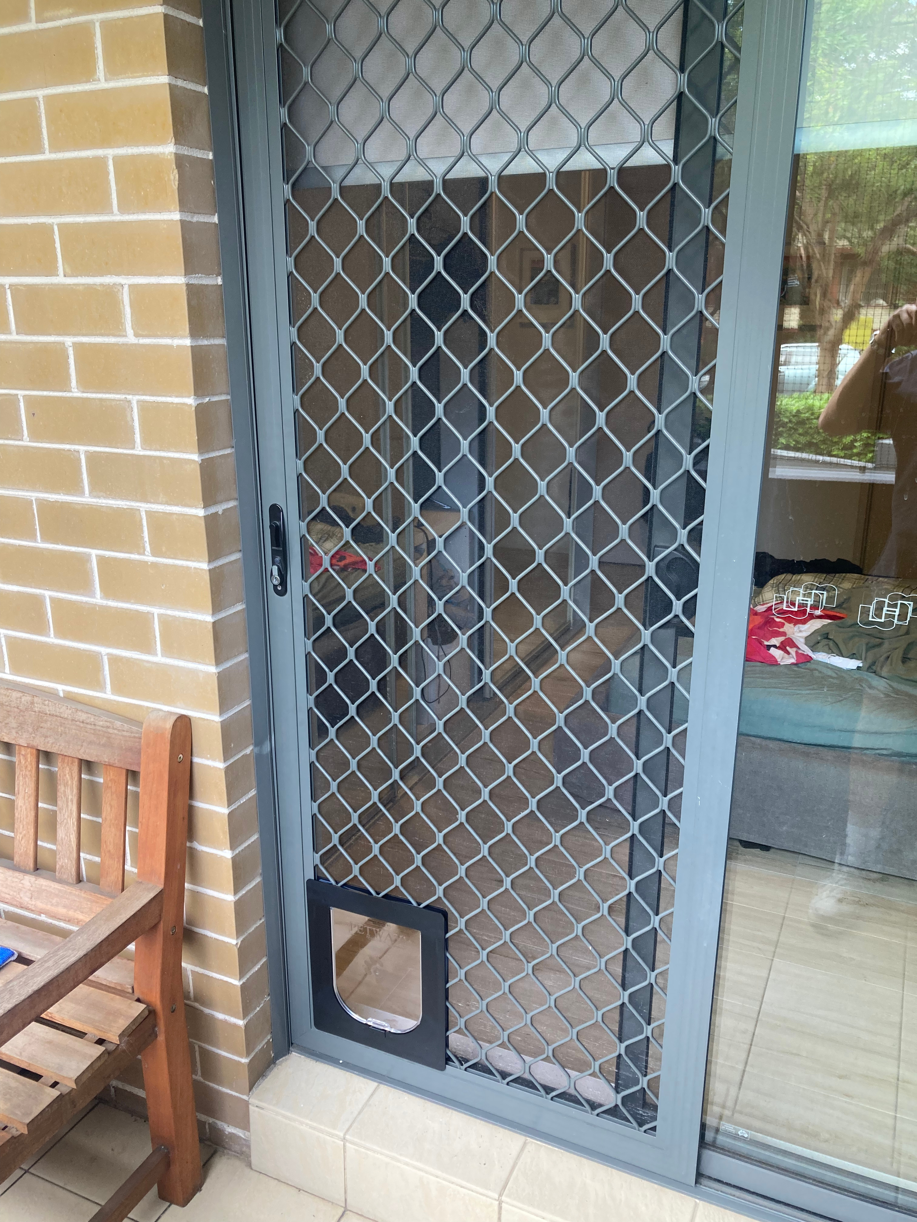 Discover the perfect solution for cat door installations in screens. Our expert technicians are skilled in integrating cat doors into screen doors and windows, allowing your furry friends to come and go as they please while keeping insects and pests out.