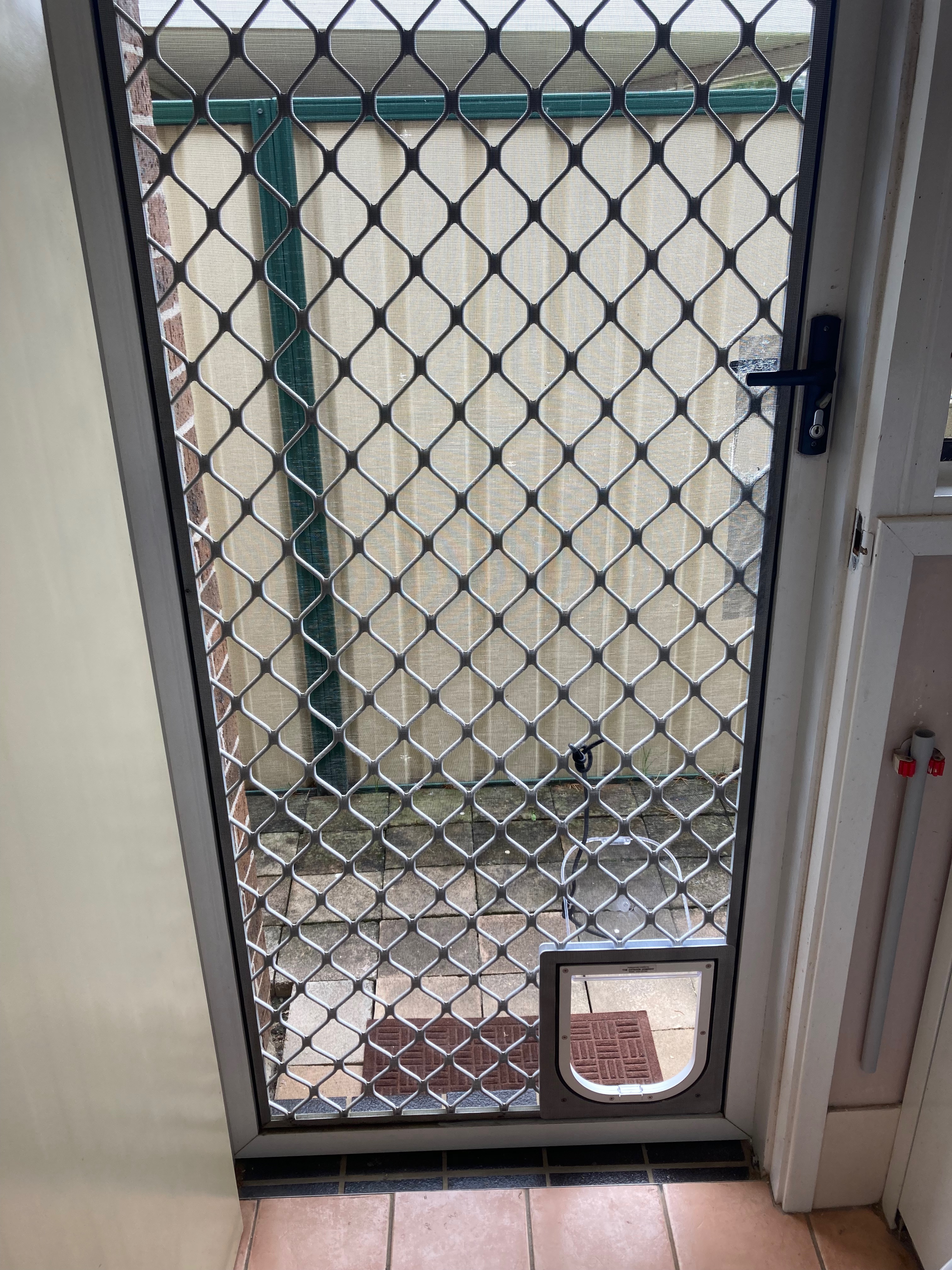 Allow your small dog to come and go as they please with our small dog door installation service in screen doors. We specialise in seamlessly integrating small dog doors into screen surfaces, providing convenient access for your furry friend while keeping insects and pests out.
